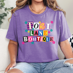 Wholesale Tori Lane Boutique Graphic Tee - Heather Team Purple Tee